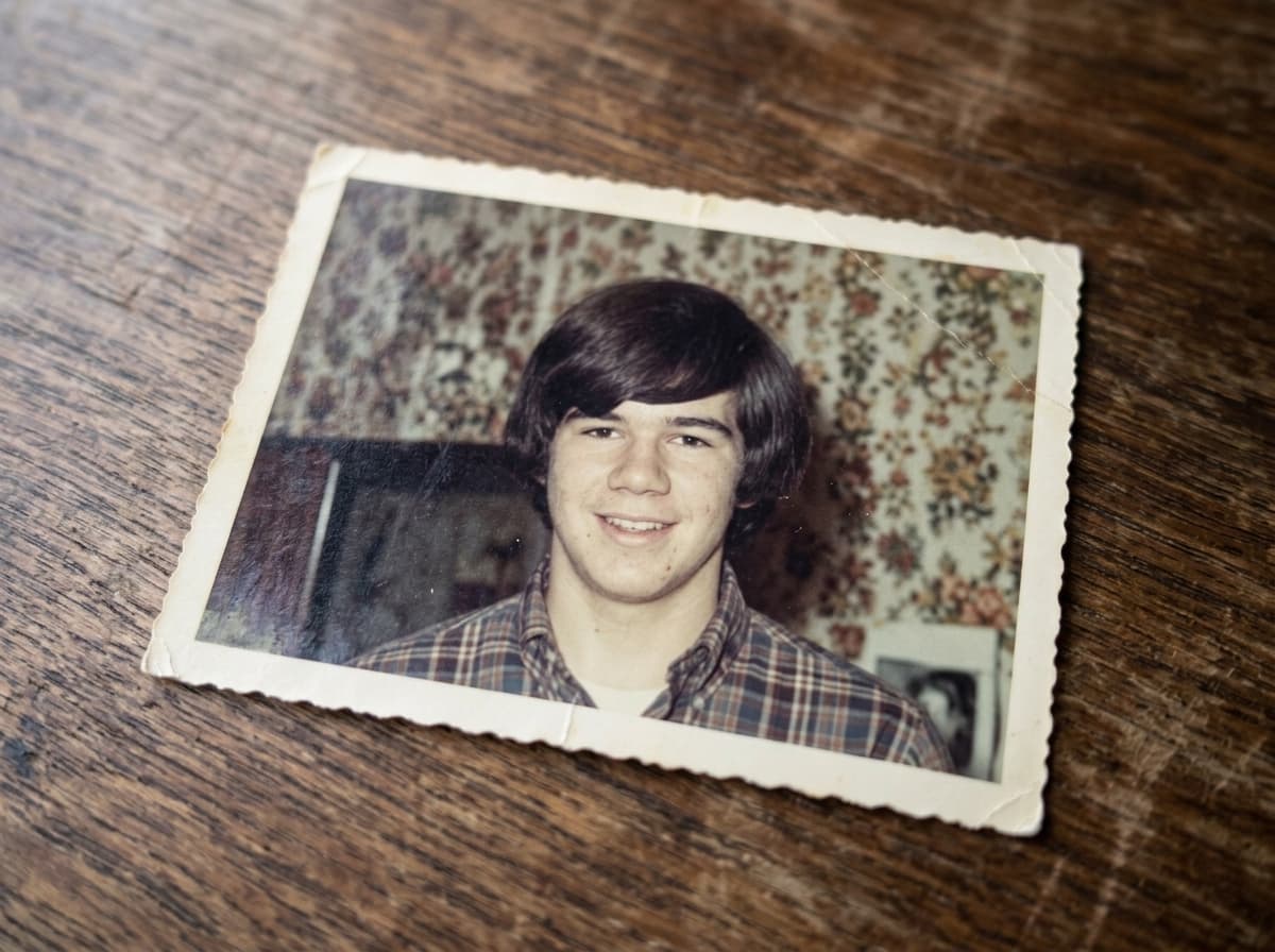 A creased colour snapshot from 1967 lying on a wooden table