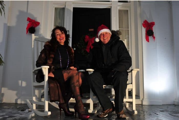 A couple on a dark porch at Christmas - the photograph, and the watercolour painted from it