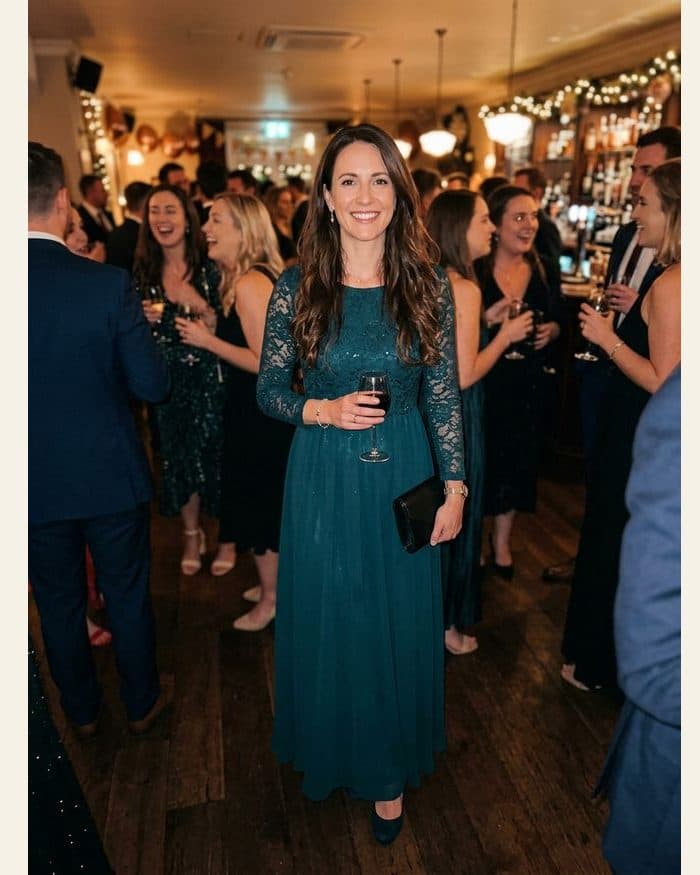 A woman raising a glass - the photograph, and the Klimt portrait painted from it