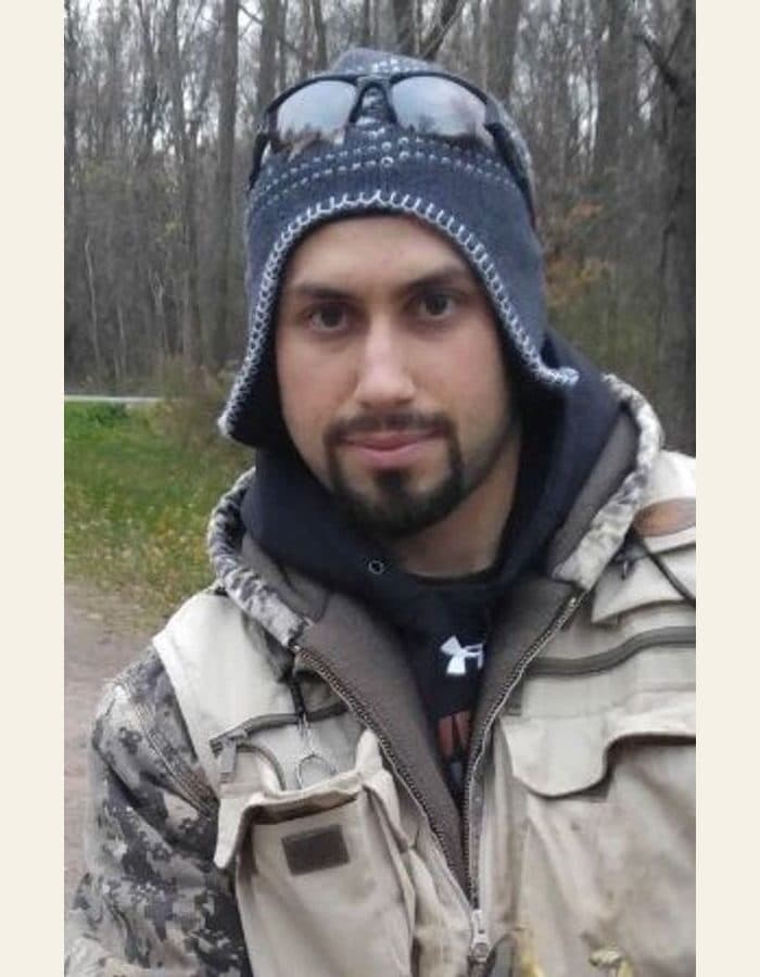 A man in a winter cap outdoors - the photograph, and the modern portrait painted from it