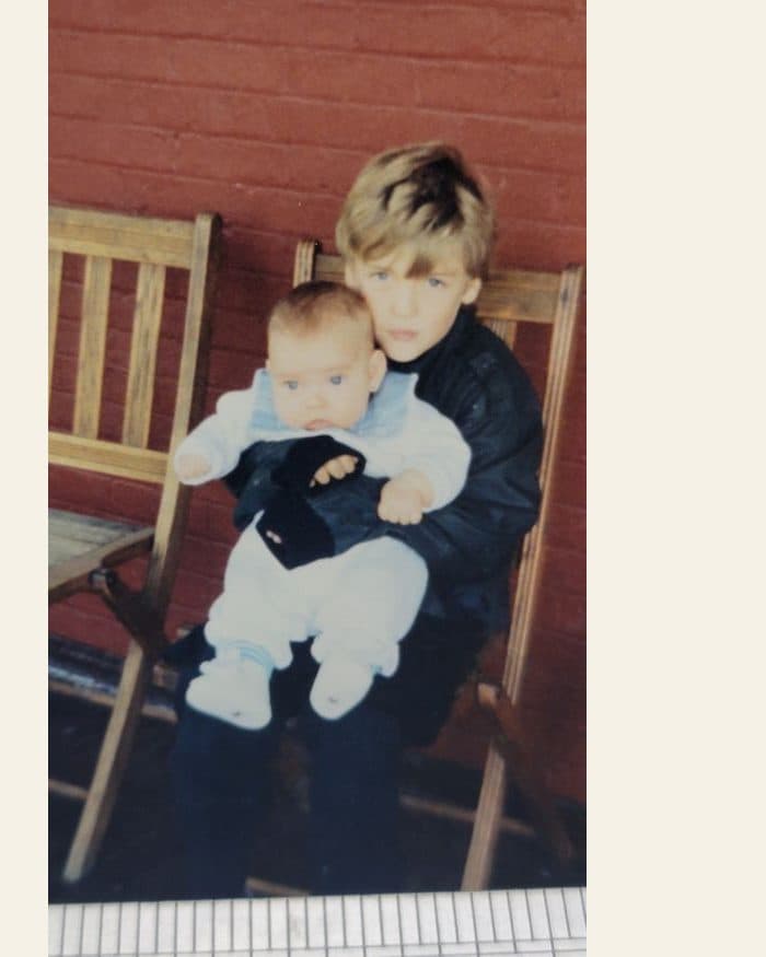 A brother holding the baby - the photograph, and the watercolour painted from it