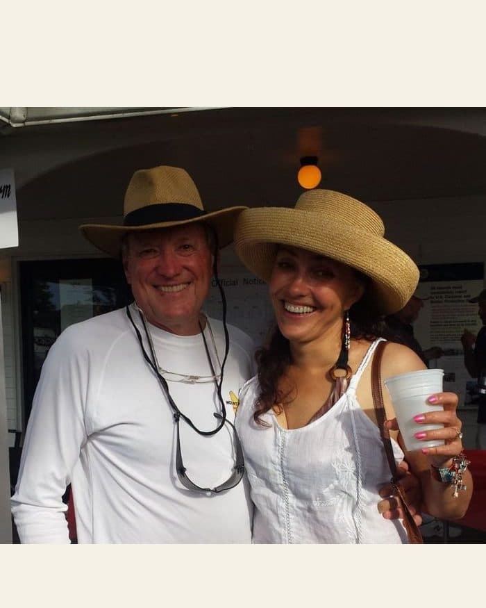 A couple in sun hats - the photograph, and the watercolour painted from it